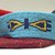 Blackfoot. <em>Beaded Cradleboard</em>, 20th century. Beads, cotton, wool, silk, felt, metal, 34 5/8 x 13 3/8 in. (87.9 x 34 cm). Brooklyn Museum, Bequest of W.S. Morton Mead, 32.2099.32581. Creative Commons-BY (Photo: Brooklyn Museum, CUR.32.2099.32581_view4.jpg)