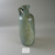 Roman. <em>Bottle with Incised Line Decoration</em>, 2nd-early 3rd century C.E. Glass, 8 1/16 x greatest diam. 3 1/8 in. (20.4 x 7.9 cm). Brooklyn Museum, Frederick Loeser Fund, 33.401. Creative Commons-BY (Photo: Brooklyn Museum, CUR.33.401_view2.jpg)