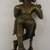  <em>Small Figure of Kirsna Bamsidhara</em>, 18th-19th century. Brass, 5 x 1 15/16 in. (12.7 x 5 cm). Brooklyn Museum, Brooklyn Museum Collection, 34.147. Creative Commons-BY (Photo: Brooklyn Museum, CUR.34.147_back.jpg)