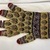  <em>Pair of Man's Gloves</em>. Yellow knitted purl stitch wool, L 25cm. Brooklyn Museum, Brooklyn Museum Collection, 34.5761. Creative Commons-BY (Photo: Brooklyn Museum, CUR.34.5761_component01_back.jpg)