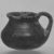Attic. <em>Miniature Vase</em>, early 4th century B.C.E. Clay, slip, 1 x Diam. 1 1/4 in. (2.5 x 3.2 cm). Brooklyn Museum, Charles Edwin Wilbour Fund, 34.720. Creative Commons-BY (Photo: Brooklyn Museum, CUR.34.720_print_cropped_bw.jpg)