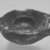 Attic. <em>Miniature Lamp</em>, 4th century B.C.E. (probably). Clay, slip, 3/8 × 1 9/16 in. (1 × 3.9 cm). Brooklyn Museum, Charles Edwin Wilbour Fund, 34.726. Creative Commons-BY (Photo: Brooklyn Museum, CUR.34.726_print_cropped_bw.jpg)