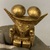  <em>Gold Idol Seated Holding a Sceptre in Each Hand with Double Mushroom Headdress</em>. Gold, 2 5/8in. (6.7cm). Brooklyn Museum, Alfred W. Jenkins Fund, 35.195. Creative Commons-BY (Photo: Brooklyn Museum, CUR.35.195_detail01.jpg)