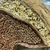  <em>Mask (Tatanua)</em>, 19th century. Wood, rattan, barkcloth, fiber, seeds, sea sponge, tapestry turban snail (Turbo petholatus) opercula, pigment, 13 × 14 × 10 in. (33 × 35.6 × 25.4 cm). Brooklyn Museum, Gift of Russell Sturgis, 35.2212. Creative Commons-BY (Photo: , CUR.35.2212_detail04.jpg)