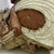  <em>Mask</em>. Wood, cloth, pigment, fibers, barkcloth, rattan, paste or plaster, tapestry turban snail (Turbo petholatus) opercula, 17 1/2 × 9 × 13 in. (44.5 × 22.9 × 33 cm). Brooklyn Museum, Gift of Appleton Sturgis, 35.2213. Creative Commons-BY (Photo: , CUR.35.2213_detail05.jpg)