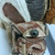  <em>Mask</em>. Wood, cloth, pigment, fibers, barkcloth, rattan, paste or plaster, tapestry turban snail (Turbo petholatus) opercula, 17 1/2 × 9 × 13 in. (44.5 × 22.9 × 33 cm). Brooklyn Museum, Gift of Appleton Sturgis, 35.2213. Creative Commons-BY (Photo: , CUR.35.2213_overall.jpg)