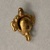  <em>Trophy Head Pendant</em>, ca. 1200 C.E. Gold, 1 1/8 × 7/8 × 7/8 in. (2.9 × 2.2 × 2.2 cm). Brooklyn Museum, Alfred W. Jenkins Fund, 35.75. Creative Commons-BY (Photo: Brooklyn Museum, CUR.35.75_back.jpg)