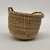 Northwest Coast. <em>Basket with Braided Handle</em>, early 20th century. Plant fiber, sweetgrass, 2 15/16 × 3 7/8 × 3 3/4 in. (7.5 × 9.8 × 9.5 cm). Brooklyn Museum, Gift of Edith E. Dexter, 36.110. Creative Commons-BY (Photo: Brooklyn Museum, CUR.36.110_back.jpg)