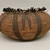 Pomo. <em>Large Basket made with the 'shi-bu' technique and decorated with woven design of a man</em>, 19th century. Bead, feather, willow, bark or root thread, 4 1/4 x (dia) 11 1/8 in. or (12.5 x 17.5 cm). Brooklyn Museum, Gift of Frederic B. Pratt, 36.519. Creative Commons-BY (Photo: Brooklyn Museum, CUR.36.519_view01.jpg)