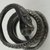  <em>Coiled Serpent</em>. Bronze, silver, 3/16 × Diam. 13/16 in. (0.5 × 2 cm). Brooklyn Museum, Charles Edwin Wilbour Fund, 37.1214E. Creative Commons-BY (Photo: Brooklyn Museum (in collaboration with Index of Christian Art, Princeton University), CUR.37.1214E_view5_ICA.jpg)