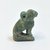  <em>Squatting Cat Amulet</em>, 664-343 B.C.E. Faience, 15/16 x 7/16 x 11/16 in. (2.4 x 1.1 x 1.7 cm). Brooklyn Museum, Charles Edwin Wilbour Fund, 37.1284E. Creative Commons-BY (Photo: Brooklyn Museum, CUR.37.1284E_view2.jpg)