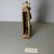  <em>Seated Osiris Figure</em>. Wood, gold leaf, linen, 5 3/16 x 1 3/8 x 3 1/16 in. (13.1 x 3.5 x 7.8 cm). Brooklyn Museum, Charles Edwin Wilbour Fund, 37.1372E. Creative Commons-BY (Photo: Brooklyn Museum, CUR.37.1372E_view2.jpg)