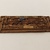  <em>Oblong Panel</em>, ca. 1539-1075 B.C.E. Wood, gesso, glass, gold leaf, lapis lazuli, pigment, 1 1/2 x 3 9/16 x 3/16 in. (3.8 x 9.1 x 0.4 cm). Brooklyn Museum, Charles Edwin Wilbour Fund, 37.1430E. Creative Commons-BY (Photo: Brooklyn Museum, CUR.37.1430E_overall02.jpg)