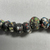  <em>Necklace</em>. Glass, Greatest diam. 13/16 × greathest length 7/16 in. (2.1 × 1.1 cm). Brooklyn Museum, Charles Edwin Wilbour Fund, 37.1446E. Creative Commons-BY (Photo: Brooklyn Museum, CUR.37.1446E_detail.JPG)