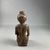  <em>Seated Female Figurine</em>, ca. 838–332 B.C.E. Wood, 4 7/16 × 1 7/8 × 1 3/4 in. (11.2 × 4.8 × 4.4 cm). Brooklyn Museum, Charles Edwin Wilbour Fund, 37.1527E. Creative Commons-BY (Photo: Brooklyn Museum, CUR.37.1527E_back.JPG)