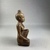  <em>Seated Female Figurine</em>, ca. 838–332 B.C.E. Wood, 4 7/16 × 1 7/8 × 1 3/4 in. (11.2 × 4.8 × 4.4 cm). Brooklyn Museum, Charles Edwin Wilbour Fund, 37.1527E. Creative Commons-BY (Photo: Brooklyn Museum, CUR.37.1527E_right.JPG)