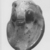 Phoenician. <em>Fantastic Head</em>, second half 7th century-5th century B.C.E. Glass, 1 1/16 x 11/16 x 11/16 in. (2.7 x 1.7 x 1.8 cm). Brooklyn Museum, Charles Edwin Wilbour Fund, 37.1654E. Creative Commons-BY (Photo: Brooklyn Museum, CUR.37.1654E_negA_bw.jpg)