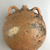  <em>Circular Flask</em>, ca. 1539–1190 B.C.E. Clay, 7 5/8 × 6 11/16 × 3 7/16 in. (19.3 × 17 × 8.7 cm). Brooklyn Museum, Charles Edwin Wilbour Fund, 37.1727E. Creative Commons-BY (Photo: Brooklyn Museum, CUR.37.1727E_view01.jpg)