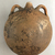 <em>Circular Flask</em>, ca. 1539–1190 B.C.E. Clay, 7 5/8 × 6 11/16 × 3 7/16 in. (19.3 × 17 × 8.7 cm). Brooklyn Museum, Charles Edwin Wilbour Fund, 37.1727E. Creative Commons-BY (Photo: Brooklyn Museum, CUR.37.1727E_view02.jpg)