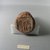  <em>Funerary Cone</em>, ca. 1400-1390 B.C.E. Terracotta, Diam. 3 1/16 x 4 13/16 in. (7.7 x 12.2 cm). Brooklyn Museum, Charles Edwin Wilbour Fund, 37.1847E. Creative Commons-BY (Photo: Brooklyn Museum, CUR.37.1847E_detail2.jpg)