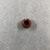  <em>Pennanular Earring</em>. Red jasper, Diam. 3/8 × 9/16 in. (0.9 × 1.5 cm). Brooklyn Museum, Charles Edwin Wilbour Fund, 37.1960E. Creative Commons-BY (Photo: , CUR.37.1960E_view02.jpg)