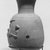  <em>Bes Jar</em>, 664-332 B.C.E. Clay, slip, 6 3/4 × Diam. 4 1/8 in. (17.2 × 10.4 cm). Brooklyn Museum, Charles Edwin Wilbour Fund, 37.328E. Creative Commons-BY (Photo: Brooklyn Museum, CUR.37.328E_NegB_print_bw.jpg)