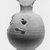  <em>Vase with Face of Bes on One Side</em>, 664–332 B.C.E. Clay, 4 13/16 x Diam. 2 3/8 in. (12.2 x 6 cm). Brooklyn Museum, Charles Edwin Wilbour Fund, 37.329E. Creative Commons-BY (Photo: Brooklyn Museum, CUR.37.329E_NegB_print_bw.jpg)