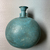 <em>Pilgrim Flask Enclosed in a Basket</em>, 664-332 B.C.E. Faience, fibers (esparto, probably), 6 11/16 × 4 3/4 in. (17 × 12 cm). Brooklyn Museum, Charles Edwin Wilbour Fund, 37.338E. Creative Commons-BY (Photo: Brooklyn Museum, CUR.37.338Ea_overall02.JPG)