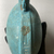 <em>Pilgrim Flask Enclosed in a Basket</em>, 664-332 B.C.E. Faience, fibers (esparto, probably), 6 11/16 × 4 3/4 in. (17 × 12 cm). Brooklyn Museum, Charles Edwin Wilbour Fund, 37.338E. Creative Commons-BY (Photo: Brooklyn Museum, CUR.37.338Ea_side02.JPG)