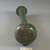  <em>Bottle</em>, 30 B.C.E.–395 C.E. Glass, Greatest Diam. 2 7/16 x 6 7/8 in. (6.2 x 17.5 cm). Brooklyn Museum, Charles Edwin Wilbour Fund, 37.353E. Creative Commons-BY (Photo: Brooklyn Museum, CUR.37.353E_view2.jpg)