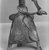 Dahomey. <em>Female Figure with Snakes</em>, late 19th century. Copper alloy, gilt, height (including tripod): 5 1/2 in.  (13.9 cm). Brooklyn Museum, A. Augustus Healy Fund, 37.366. Creative Commons-BY (Photo: Brooklyn Museum, CUR.37.366_print_detail_bw.jpg)