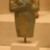  <em>Funerary Figurine of Akhenaten</em>, ca. 1352-1336 B.C.E. Faience, 4 13/16 x width at elbows 2 13/16 in. (12.3 x 7.2 cm). Brooklyn Museum, Charles Edwin Wilbour Fund, 37.503. Creative Commons-BY (Photo: Brooklyn Museum, CUR.37.503_wwgA-3.jpg)