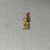  <em>Amulet Representing a Funerary God</em>, ca. 760-656 B.C.E or 305-30 B.C.E. Gold, 13/16 × 11/16 in. (2 × 1.8 cm). Brooklyn Museum, Charles Edwin Wilbour Fund, 37.820E. Creative Commons-BY (Photo: Brooklyn Museum, CUR.37.820E_back.JPG)