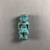  <em>Amulet of Pataikos</em>, 664-332 B.C.E. Faience, 1 7/16 × 5/8 × 1/2 in. (3.6 × 1.6 × 1.2 cm). Brooklyn Museum, Charles Edwin Wilbour Fund, 37.989E. Creative Commons-BY (Photo: , CUR.37.989E_view02.jpg)