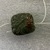  <em>Carved Jade Bead</em>. Jadeite, 15/16 x 1/2 x 1 in. (2.4 x 1.3 x 2.5 cm). Brooklyn Museum, Carll H. de Silver Fund, 38.57. Creative Commons-BY (Photo: Brooklyn Museum, CUR.38.57_bottom.jpg)