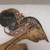  <em>Shadow Play Figure (Wayang kulit)</em>. Leather, pigment, wood, fiber, metal, 26 9/16 × 9 5/8 in. (67.5 × 24.5 cm). Brooklyn Museum, Gift of S. Koperberg, 39.419. Creative Commons-BY (Photo: , CUR.39.419_detail1.jpg)