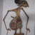  <em>Shadow Play Figure (Wayang kulit)</em>. Leather, pigment, wood, fiber, metal, 26 9/16 × 9 5/8 in. (67.5 × 24.5 cm). Brooklyn Museum, Gift of S. Koperberg, 39.419. Creative Commons-BY (Photo: , CUR.39.419_overall.jpg)