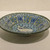  <em>Dish with a Seated Deer</em>, late 13th to 14th century. Ceramic, Sultanabad ware; fritware, painted in black, blue, and turquoise under a transparent glaze, 1 15/16 x 7 9/16 in. (5 x 19.2 cm). Brooklyn Museum, Gift of Mrs. Horace O. Havemeyer, 42.212.9. Creative Commons-BY (Photo: Brooklyn Museum, CUR.42.212.9_view1.jpg)