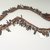 Plains (Northern or Central). <em>Bandolier</em>, late 19th-early 20th century. Hide, cotton seeds, dew claws, 25 9/16 x 1 15/16 in. (64.9 x 4.9 cm). Brooklyn Museum, Anonymous gift in memory of Dr. Harlow Brooks, 43.201.44. Creative Commons-BY (Photo: Brooklyn Museum, CUR.43.201.44_view1.jpg)