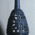  <em>Bottle with Openwork Shell</em>, ca. 1075-712 B.C.E. Egyptian blue, 6 11/16 x greatest diam. 2 15/16 in. (17 x 7.5 cm). Brooklyn Museum, Charles Edwin Wilbour Fund, 44.175. Creative Commons-BY (Photo: Brooklyn Museum, CUR.44.175_view3.jpg)