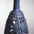  <em>Bottle with Openwork Shell</em>, ca. 1075-712 B.C.E. Egyptian blue, 6 11/16 x greatest diam. 2 15/16 in. (17 x 7.5 cm). Brooklyn Museum, Charles Edwin Wilbour Fund, 44.175. Creative Commons-BY (Photo: Brooklyn Museum, CUR.44.175_view4.jpg)