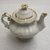 Tucker and Hemphill. <em>Miniature Teaset</em>, 1831-1837. Porcelain, Teapot: 3 in. (7.6 cm). Brooklyn Museum, Gift of Arthur W. Clement, 48.1.1a-h. Creative Commons-BY (Photo: Brooklyn Museum, CUR.48.1.1a-b_side.jpg)