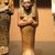  <em>Shabti of Setau</em>, ca. 1352-1322 B.C.E. Wood, pigment, 9 1/4 x 3 1/8 in. (23.5 x 8 cm). Brooklyn Museum, Charles Edwin Wilbour Fund, 48.26.3. Creative Commons-BY (Photo: Brooklyn Museum, CUR.48.26.3_mummychamber.jpg)