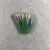  <em>Necklace Terminal in Form of Lotus</em>. Faience, 1 3/8 × 1 7/16 × 1/4 in. (3.5 × 3.6 × 0.6 cm). Brooklyn Museum, Charles Edwin Wilbour Fund, 49.13. Creative Commons-BY (Photo: , CUR.49.13_view01.jpg)