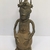 Edo. <em>Figure of an Oba</em>, 19th or 20th century. Copper alloy, 12 3/16 × 5 1/8 in. (31 × 13 cm). Brooklyn Museum, Gift of Arturo and Paul Peralta-Ramos, 56.6.71. Creative Commons-BY (Photo: , CUR.56.6.71_front.jpg)