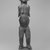 Ngbaka. <em>Figure of Standing Female</em>, late 19th-early 20th century. Wood, metal, plastic beads, 12 1/4 x 4 1/2 x 3 1/2 in. (54.0 x 11.7 x 8.2 cm). Brooklyn Museum, Gift of Arturo and Paul Peralta-Ramos, 56.6.85. Creative Commons-BY (Photo: Brooklyn Museum, CUR.56.6.85_print_front_bw.jpg)