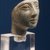  <em>Head of Woman</em>, ca. 1353-1075 B.C.E. Glass, 2 1/2 x 1 9/16 x 2 13/16 in. (6.4 x 4 x 7.1 cm). Brooklyn Museum, Charles Edwin Wilbour Fund, 57.164. Creative Commons-BY (Photo: Brooklyn Museum, CUR.57.164_view1.jpg)