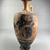 Greek. <em>Black-Figure Lekythos</em>, early 5th century B.C.E., with modern additions. Clay, slip, 7 11/16 × Diam. 3 1/2 in. (19.5 × 8.9 cm). Brooklyn Museum, Gift of Augustino Caltagirone, 58.15. Creative Commons-BY (Photo: Brooklyn Museum, CUR.58.15_view01.jpg)