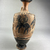 Greek. <em>Black-Figure Lekythos</em>, early 5th century B.C.E., with modern additions. Clay, slip, 7 11/16 × Diam. 3 1/2 in. (19.5 × 8.9 cm). Brooklyn Museum, Gift of Augustino Caltagirone, 58.15. Creative Commons-BY (Photo: Brooklyn Museum, CUR.58.15_view04.jpg)