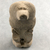  <em>Statuette of a Seated Cynocephalus Ape</em>. Limestone, 2 7/8 × 1 1/2 × 1 5/16 in. (7.3 × 3.8 × 3.3 cm). Brooklyn Museum, Charles Edwin Wilbour Fund, 58.32.2. Creative Commons-BY (Photo: , CUR.58.32.2_view02.jpg)
